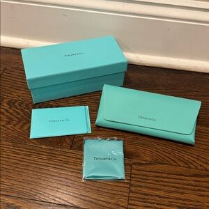 Tiffany sunglass case. Brand new never used. Comes with case, box and cloth.